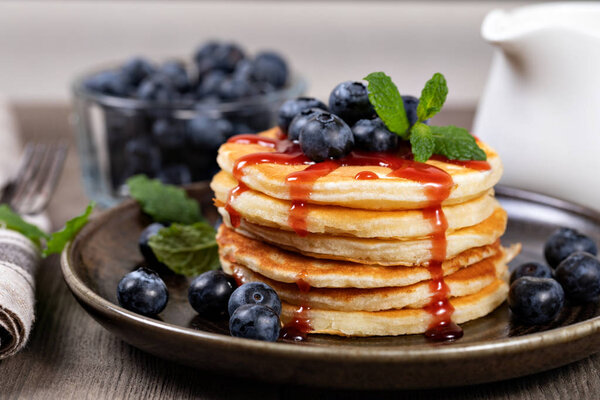 Pancakes with blueberries and syrup