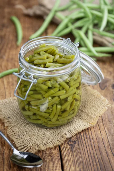 Portion of canned Green Beans (close-up shot; selective focus)
