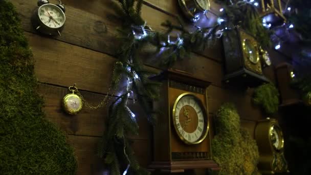 Wooden Wall Hanging Many Clocks Clock Fir Branches Christmas Garland — Stock Video