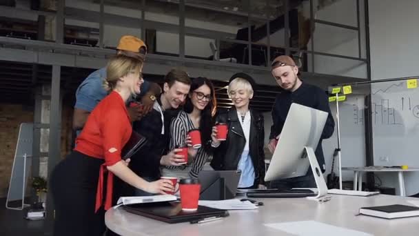 Team of hipster office worker clinking a cup of tea, coffee after finishing work day. — Stock Video