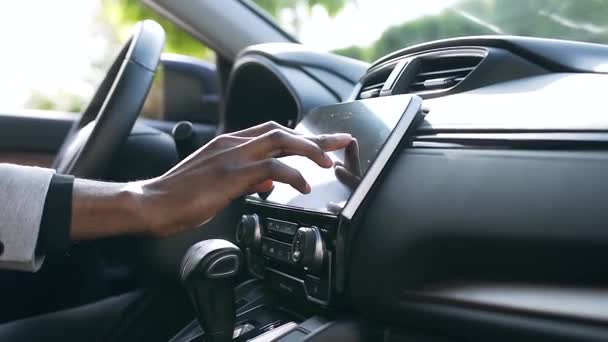 Close up of the male hand using touch screen monitor on black vehicle — Stock Video