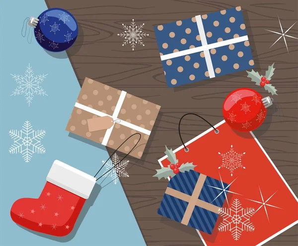 Vánoční dárky, kuličky a dárkový balíček na stůl. Pohled shora. — Stockový vektor