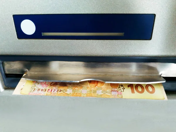 cash withdrawal from ATM. banknotes in ATM. banknotes dispensed from an ATM.