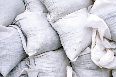 Beyaz kum torbaları yapımından arka plan. Fotoğraf tamir iÅ leri. Konsept oluşturma