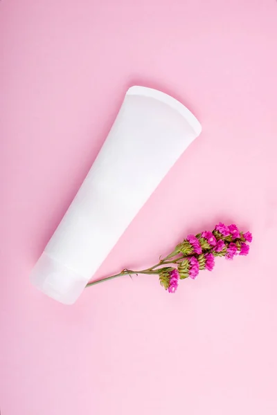 Cosmetic tube mockup isolated on pink background. Cosmetic bottle mock up.