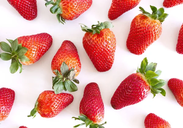 Food background with plenty of juicy strawberry on white background.Summer ripe berries.Delicious fruit.