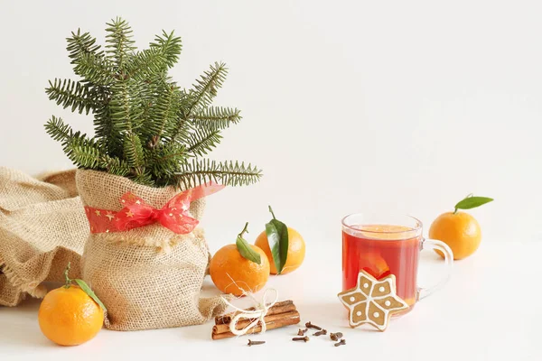Christmas, Thanksgiving drinks. Autumn, winter cocktail grog, , mandarin, rosemary, cinnamon, anise. On white table. With twigs. — Stock Photo, Image