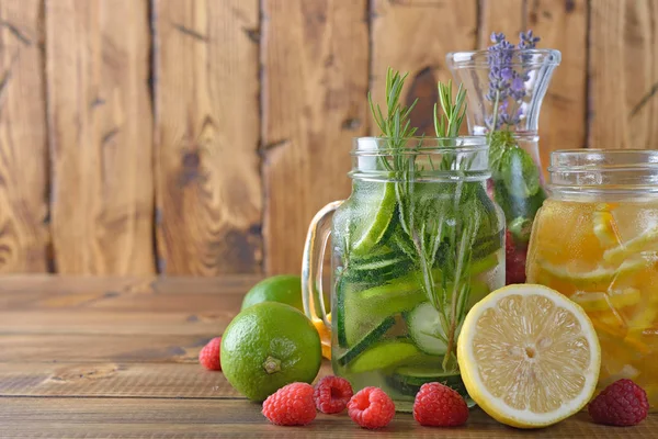 Infused fruit detox water on a wooden background