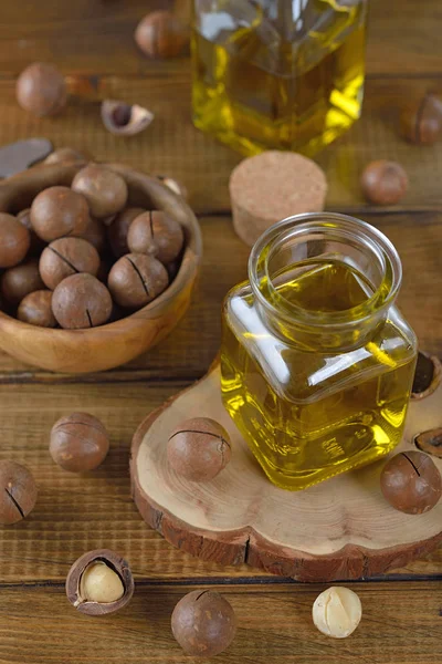 Biologische Macadamia Olie Bruine Achtergrond — Stockfoto