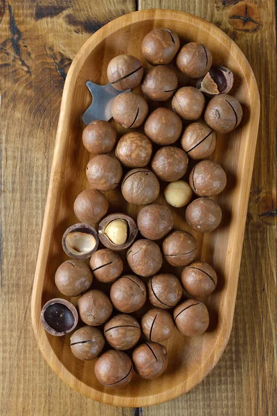 Macadamia Nuts Wooden Bowl Brown Background — Stock Photo, Image
