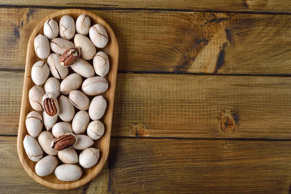 Bio Pekannüsse Auf Braunem Hintergrund — Stockfoto