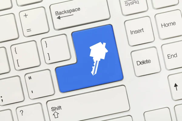 Bílá koncepční klávesnice - modré tlačítko se symbolem nemovitostí — Stock fotografie