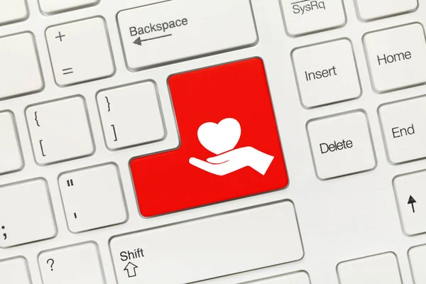 White conceptual keyboard - Healthcare symbol (red key)