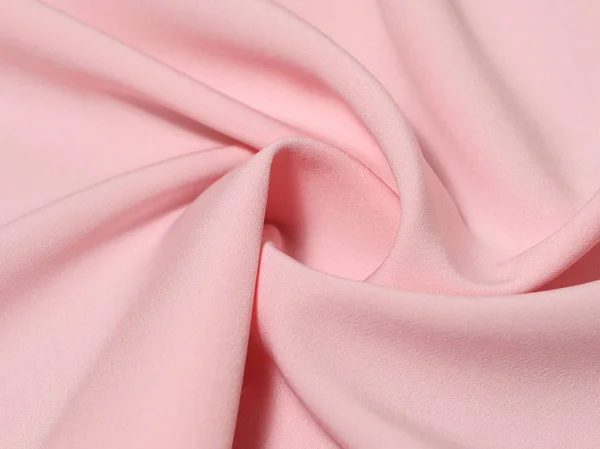 Скрученная розовая ткань — стоковое фото