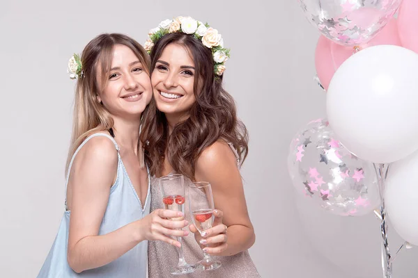 stock image attractive happy women holding glasses with champagne and hugging while celebrating bachelorette party