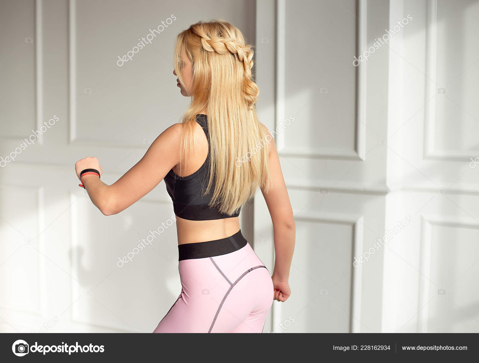 Young Slim Woman Athletic Body Long Blonde Hair Dressed Black Stock Photo  by ©VBStudio 228162934