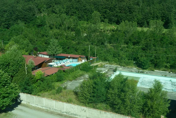 Europe, Italy, La Spezia to Kasltelruth train, a train that is on top of a lush green forest