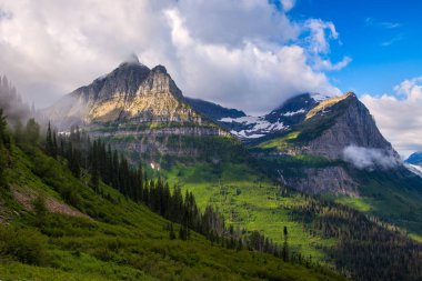 View of the mountains from Logans Pass in Glacier National Park Montana clipart