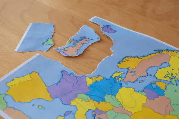 a torn paper map symbolizing the UK leaving the European Union or Brexit