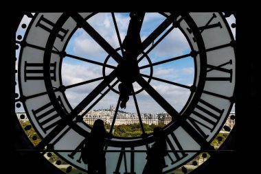 Paris cityscape through the giant glass clock at the Musee dOrsay clipart