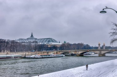 Snowfall over Paris clipart