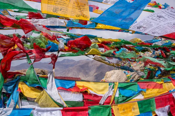 Tibetan landscape with prayer flags in foreground