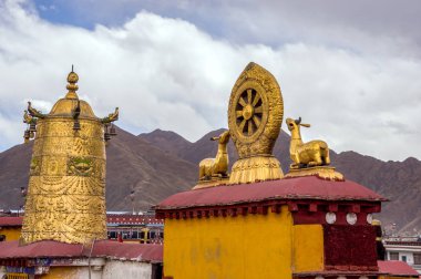 Rooftop Dharma wheel in Jokhang temple - Lhasa, Tibet clipart
