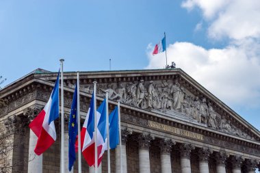 French and European flags in the wind in front of National Assem clipart