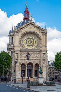 Paris, France - June 18 2020: Church of Saint Augustin and equestrian statue of Jeanne d'Arc (by Paul Dubois 1829-1905) - Paris, France. clipart