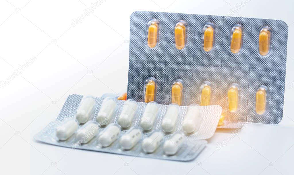 Cefixime and azithromycin capsule in blister pack for treatment gonorrhea. Neisseria Gonorrhoeae treatment. Antibiotic drug resistance. Orange and white pill. Sexually Transmitted Diseases concept.