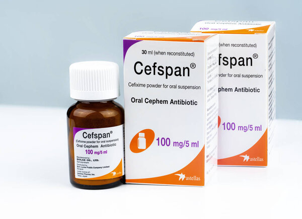 CHONBURI, THAILAND-AUGUST 3, 2018 : Cefspan 100 mg/5 ml. Oral Cephem Antibiotic. Cefixime powder for oral suspension 30 ml when reconstituted. Antibiotic drug in amber glass bottle and Childproof cap