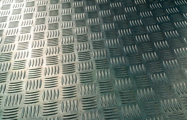 Industrial metal checker plate. Metal checker plate texture background. Metal checkerplate for anti skid. Embossed metal sheet floor. Silver bump ground with art pattern. Silver texture background.