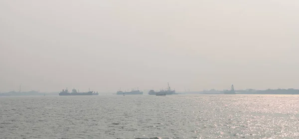 Air pollution at the pier. Bad air quality filled with dust causes of respiratory diseases. Global warming from air pollution problem. Environmental problem from gas carbon monoxide and dust. PM 2.5