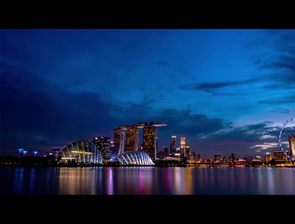 SINGAPORE-MAY 19, 2019 : Singapore sunset timelapse from day to night with beautiful night light. Landscape of business building and hotel. Cityscape Singapore modern and financial city in Asia. Marina bay landmark Singapore.