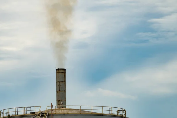 Air pollution from factory. Black smoke from chimney of industrial pipe. Global warming problem concept. Air pollutant emission factors. Air contamination. PM 2.5 dust. Triggers of asthma and COPD.