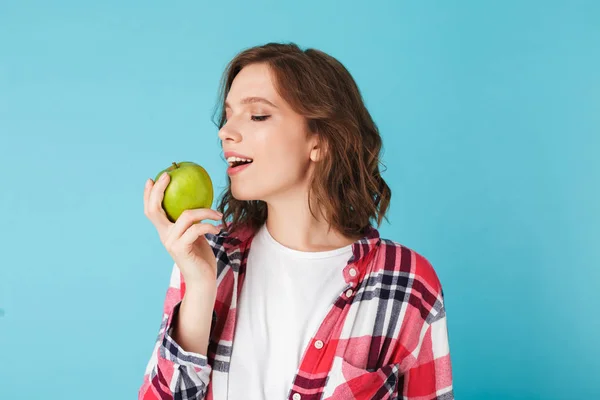 Mooi Meisje Plaid Shirt Eten Groene Appel Kleurrijke Achtergrond — Stockfoto