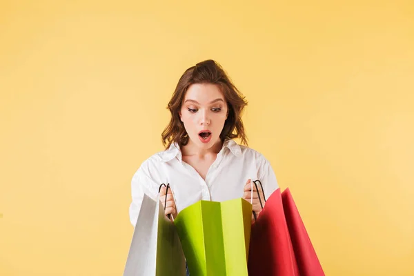Portrait Young Astonished Lady Standing Colorful Shopping Bags Hands Amazedly — Stock Photo, Image