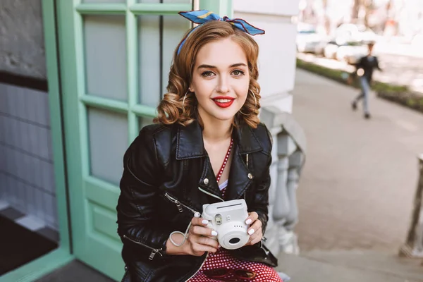 Beautiful Lady Leather Jacket Sitting Door Cafe Little White Camera — Stock Photo, Image