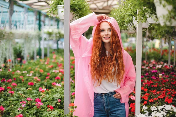 Pretty Smiling Lady Redhead Curly Hair Standing Pink Raincoat Dreamily — Stock Photo, Image