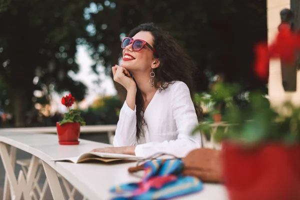 Young Smiling Woman Dark Curly Hair Sunglasses Standing Notepad Dreamily — Stock Photo, Image