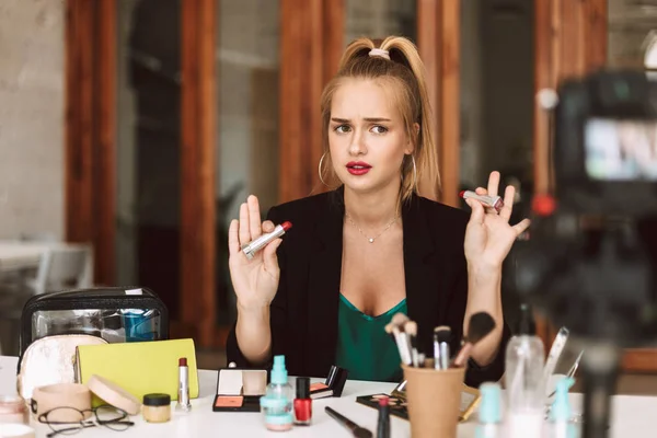 Young Beauty Blogger Sadly Looking Aside Holding Lipsticks Hands Recording — Stock Photo, Image