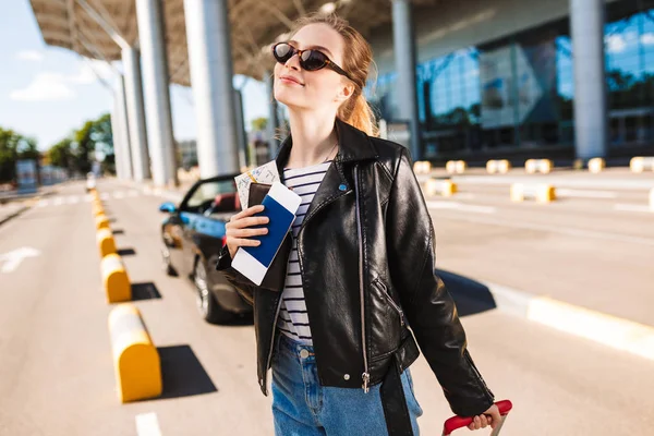 Smiling Girl Sunglasses Leather Jacket Passport Flight Ticket Hand Dreamily — Stock Photo, Image