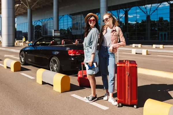Beautiful Girls Sunglasses Joyfully Looking Camera Red Suitcases Cabriolet Car — Stock Photo, Image