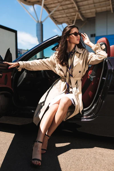 Beautiful Lady Sunglasses Trench Coat Heels Cabriolet Car Dreamily Looking — Stock Photo, Image