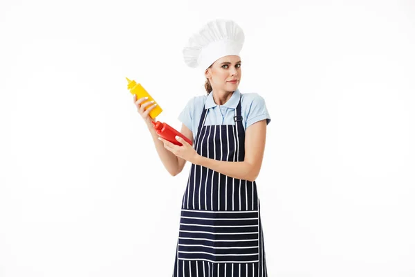 Young Verbaasde Vrouw Chef Kok Gestreepte Schort Witte Hoed Zorgvuldig — Stockfoto