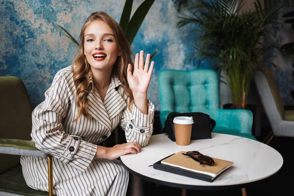 Beautiful Smiling Girl Wavy Hair Striped Trench Coat Happily Waving — Stock Photo, Image