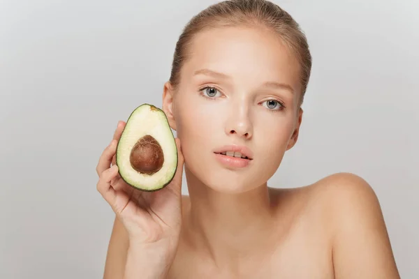 Portrait Young Pensive Woman Makeup Holding Half Avocado Hand Thoughtfully — Stock Photo, Image