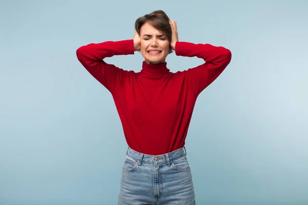 Young Annoyed Woman Red Sweater Jeans Closing Ears Hands Blue — Stock Photo, Image