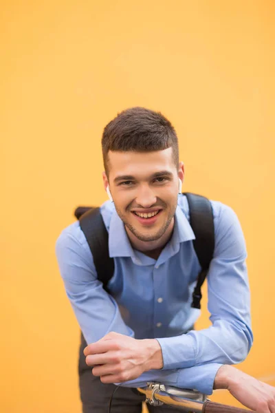 Young Handsome Smiling Man Blue Shirt Black Backpack Wireless Earphones — Stock Photo, Image