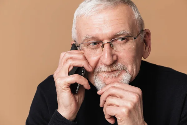 Old handsome man with gray hair and beard in eyeglasses and swea — Stock Photo, Image